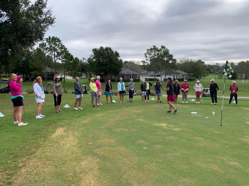 golf instructor teaching a large group